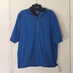 Greg Norman sports top